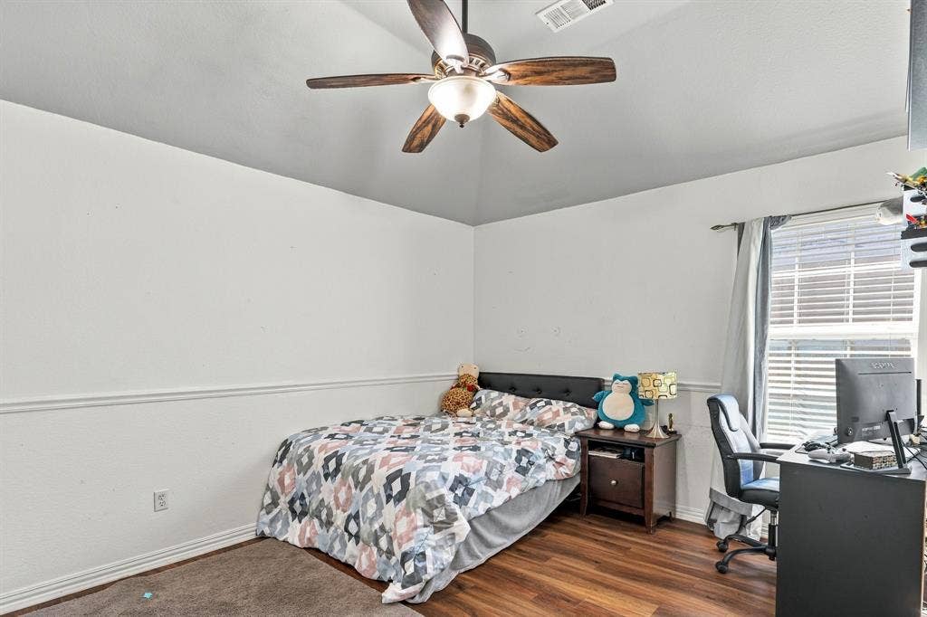 1905 Canyon Wren Drive, McKinney, TX 75071 Vaulted ceiling with a ceiling fan, wood-style flooring, and window with blinds