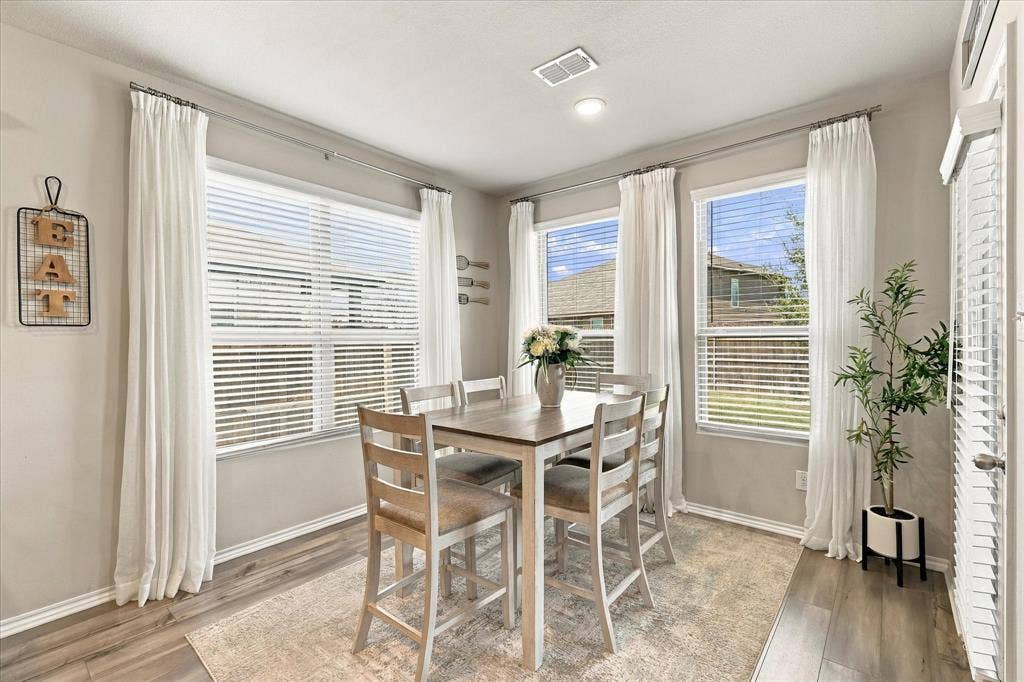 6304 Jib Court, Fort Worth, TX 76179 Wood-finish flooring, recessed ceiling lighting, light gray wall color, white trim, and white window blinds