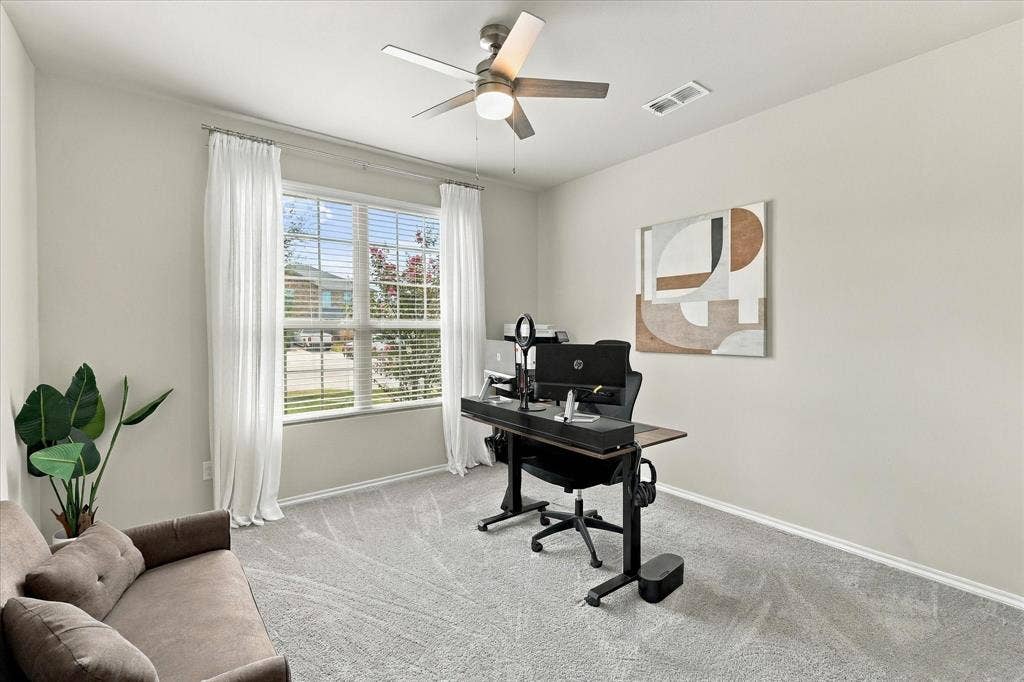 6304 Jib Court, Fort Worth, TX 76179 Light-colored walls, window with blinds, ceiling fan, and grey patterned carpet