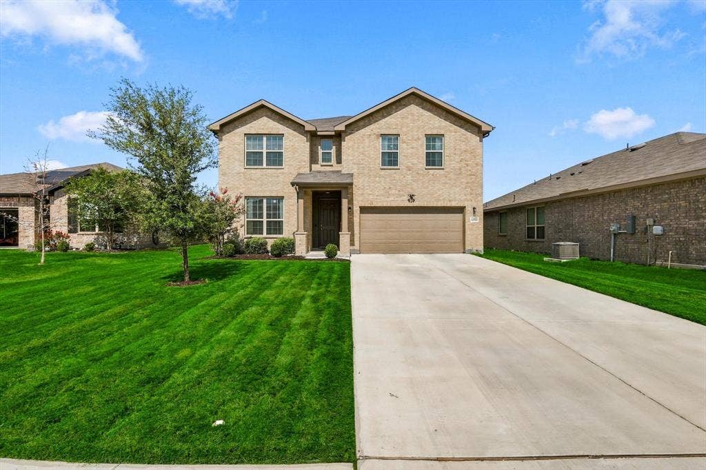 6304 Jib Court, Fort Worth, TX 76179 Brick exterior with a gabled roof and attached garage