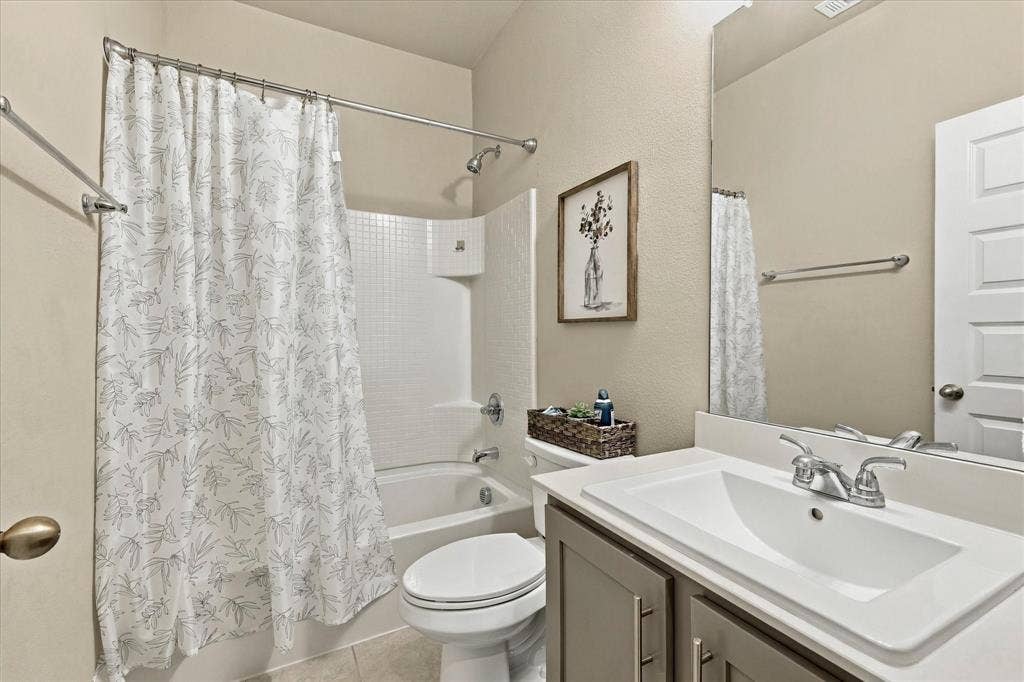 6304 Jib Court, Fort Worth, TX 76179 Full bathroom featuring a single vanity with storage, integrated sink, and chrome faucet