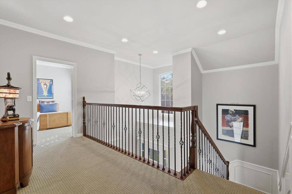5600 Southern Hills Drive, Frisco, TX 75034 Upstairs, two guest bedrooms share an updated Jack-and-Jill bath, and a spacious, shelf lined closet and walk-in attic provide convenient storage.