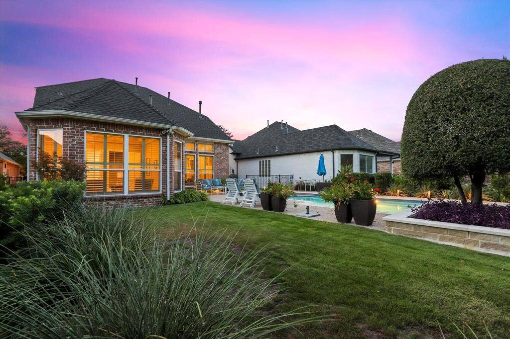 5600 Southern Hills Drive, Frisco, TX 75034 Landscaped grounds and an adjoining lawn complement the poolside patio and the home’s expansive windows, while offering room for pets and play.