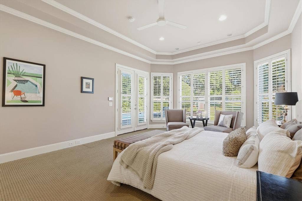 5600 Southern Hills Drive, Frisco, TX 75034 Primary bedroom has double doors to the outdoor living area.