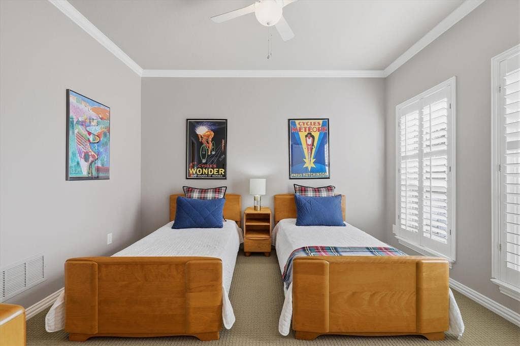 5600 Southern Hills Drive, Frisco, TX 75034 One of two upstairs guest bedrooms, this inviting space features plantation shutters, crown molding and access to the updated Jack-and-Jill bath.