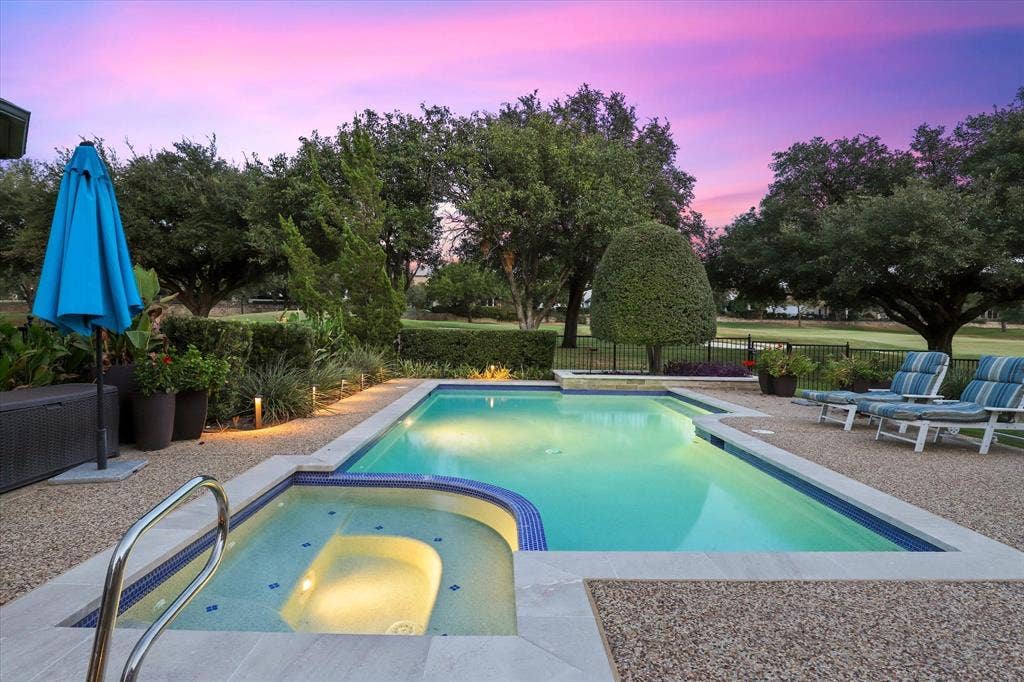 5600 Southern Hills Drive, Frisco, TX 75034 Panoramic golf course views and the sparkling pool and spa set the stage for relaxed outdoor living.