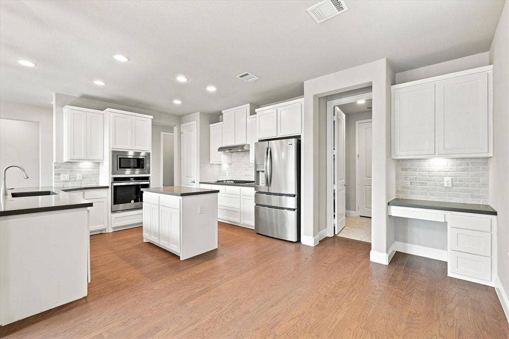 Adjacent to kitchen is the popular command center.
