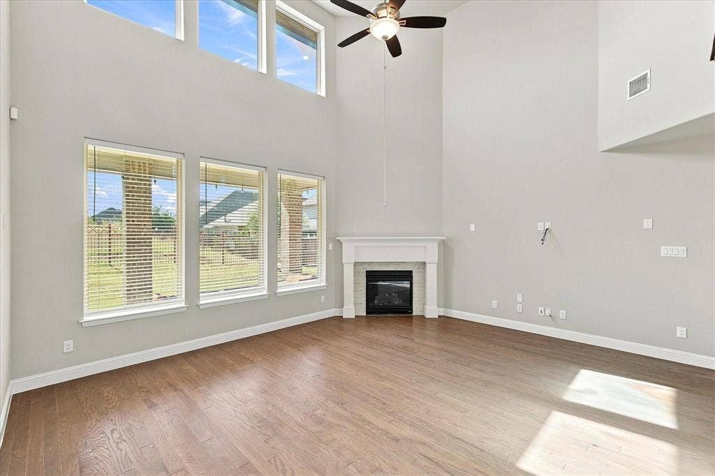 Soaring ceilings with upper transom windows.