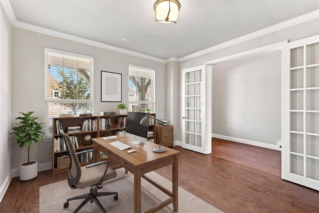 Front home office with French doors- virtually staged photo
