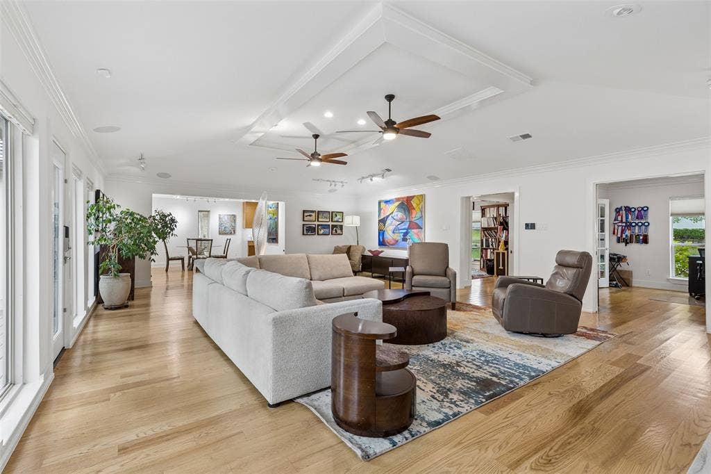 Connected Living with Flexible Flow — This wide-angle view shows how the main living area connects naturally to adjacent rooms, creating an open, easy-to-navigate layout with multiple pathways for everyday living and entertaining.