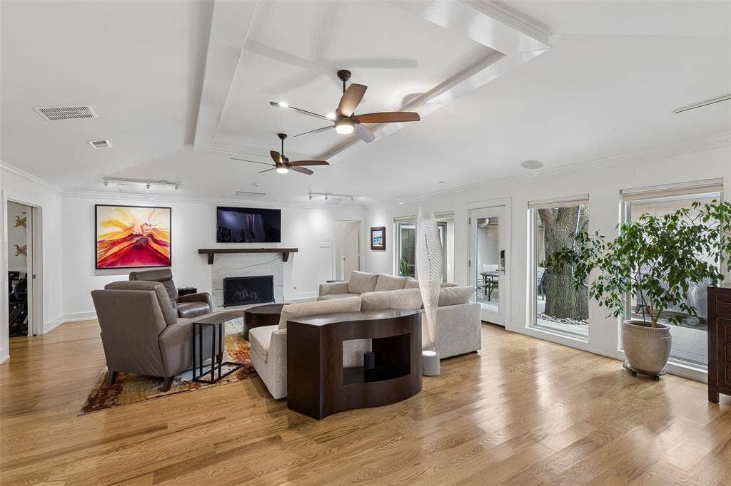 Fireplace-Focused Living — The remodeled fireplace and mantel anchor this substantial living area, while the open layout provides generous space to arrange distinct sitting and entertainment zones.