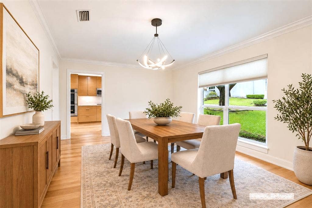 Dining with a Direct Kitchen Connection — This well-proportioned dining room sits just steps from the remodeled kitchen, creating an effortless setup for everyday meals, entertaining, and holiday gatherings.