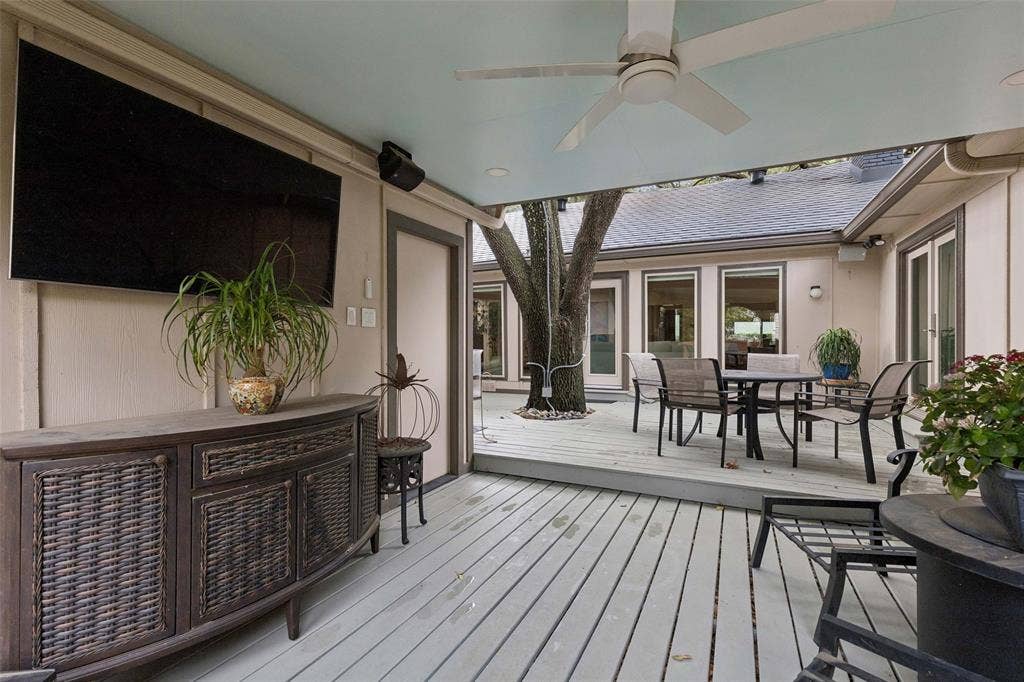 Covered Outdoor Living — A covered patio extends the usable living space outdoors with room for seating, dining, and enjoying the backyard in a more sheltered setting.