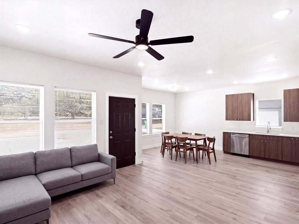 105 Oak Ridge Road, Mabank, TX 75156 Recessed lighting, wood-finish flooring, dark wood-tone cabinetry, stainless steel dishwasher, and a ceiling fan