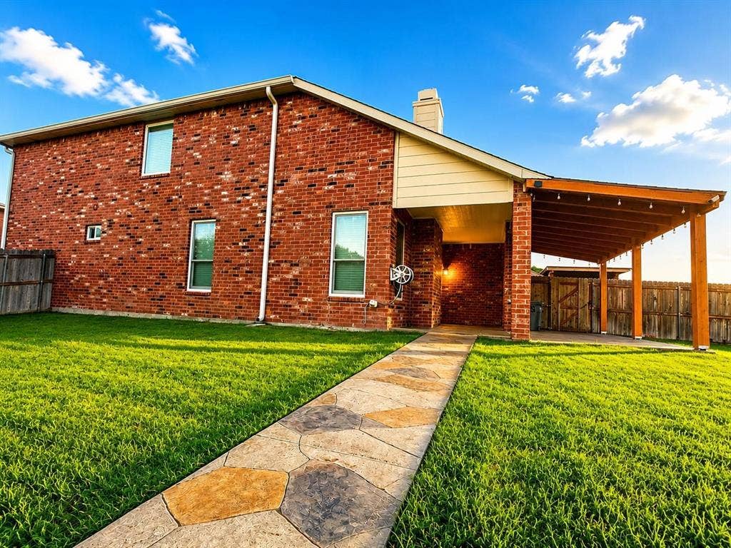 1114 Hidden Creek Drive, Allen, TX 75002 Brick exterior with multiple windows