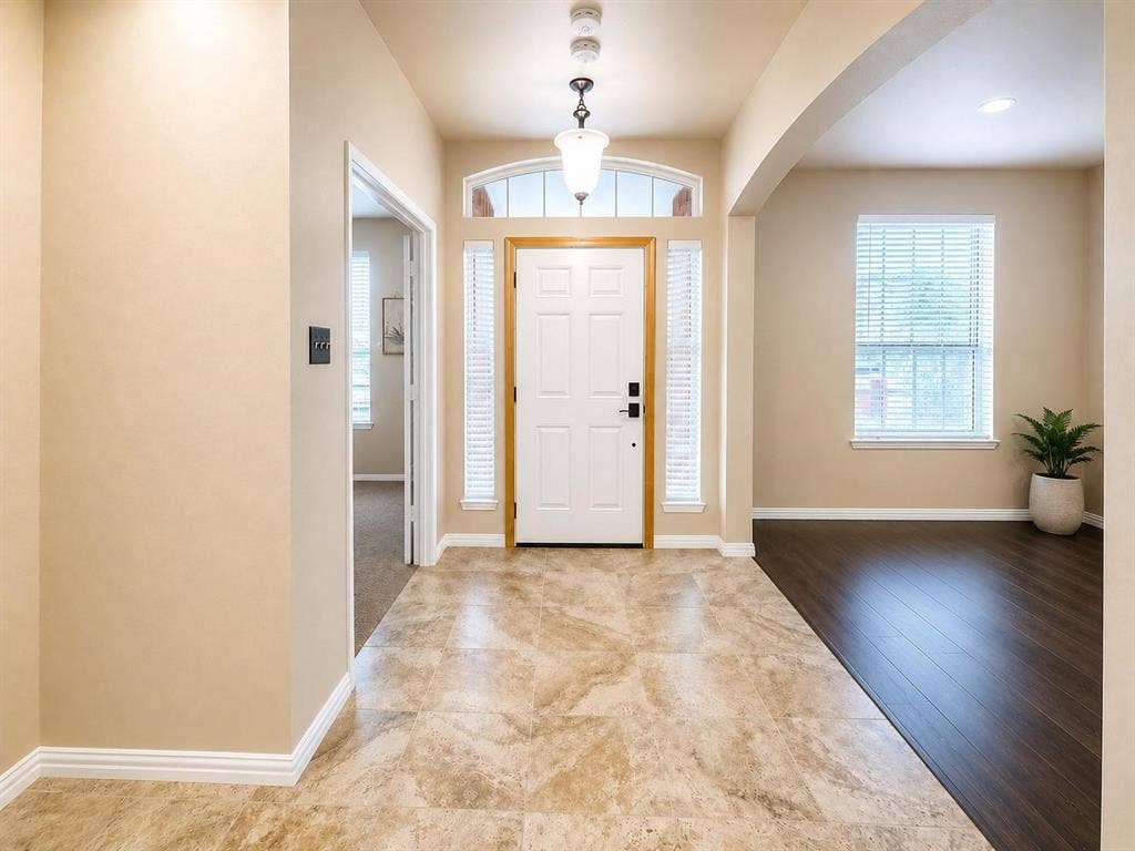 1114 Hidden Creek Drive, Allen, TX 75002 Foyer featuring tile flooring, a white front door with sidelights, and a transom window