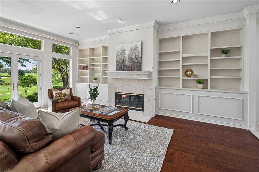 2204 Creekside Circle S, Irving, TX 75063 Built-in shelving, Hickory wood flooring, recessed lighting, and a fireplace with tile surround
