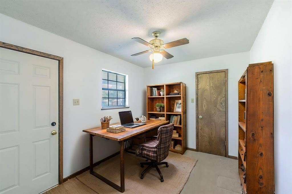 118 Spring Lake Drive, Lacy Lakeview, TX 76705 Complete with a large walk in closet and outside entrance this can be a small 4th bedroom or an efficient office.