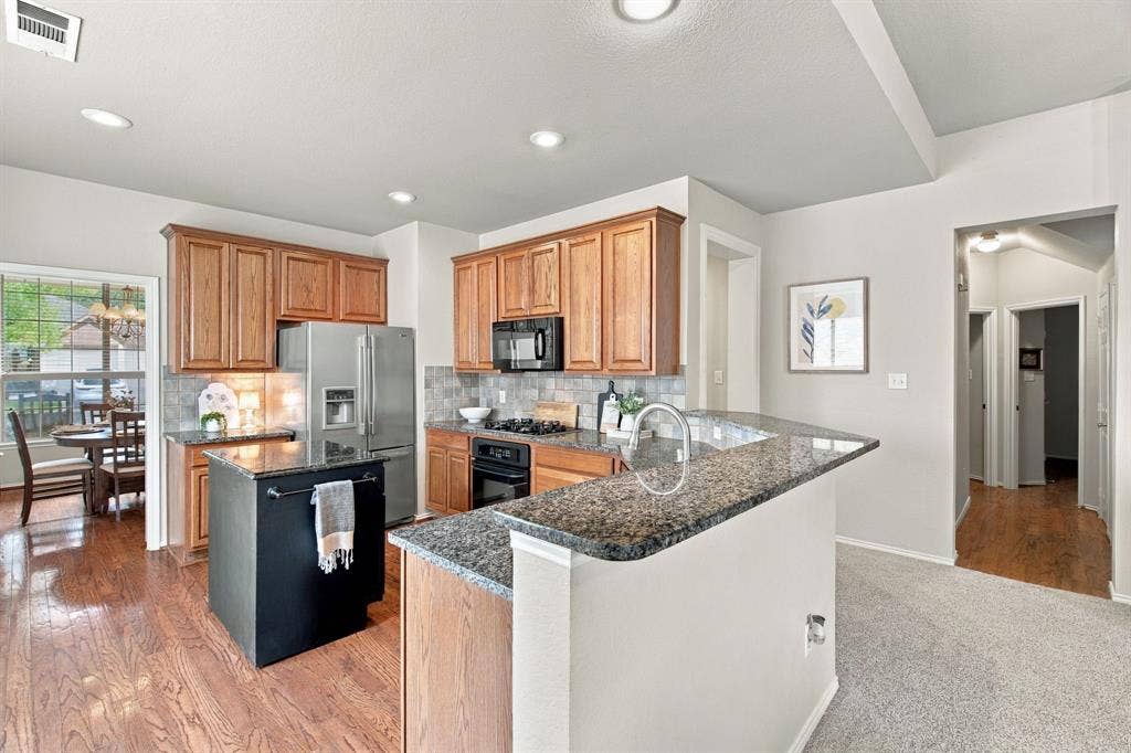 4220 Boxwood Drive, Denton, TX 76208 Hardwoods in the kitchen make this an elevated looking space.