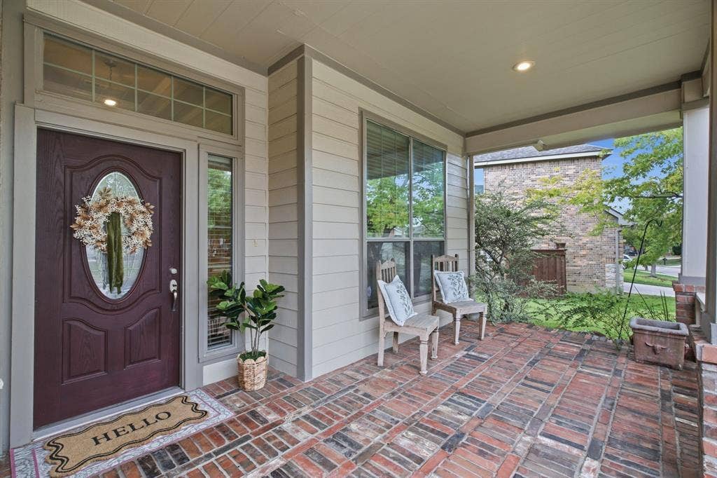 4220 Boxwood Drive, Denton, TX 76208 Welcoming covered front porch with brick flooring
