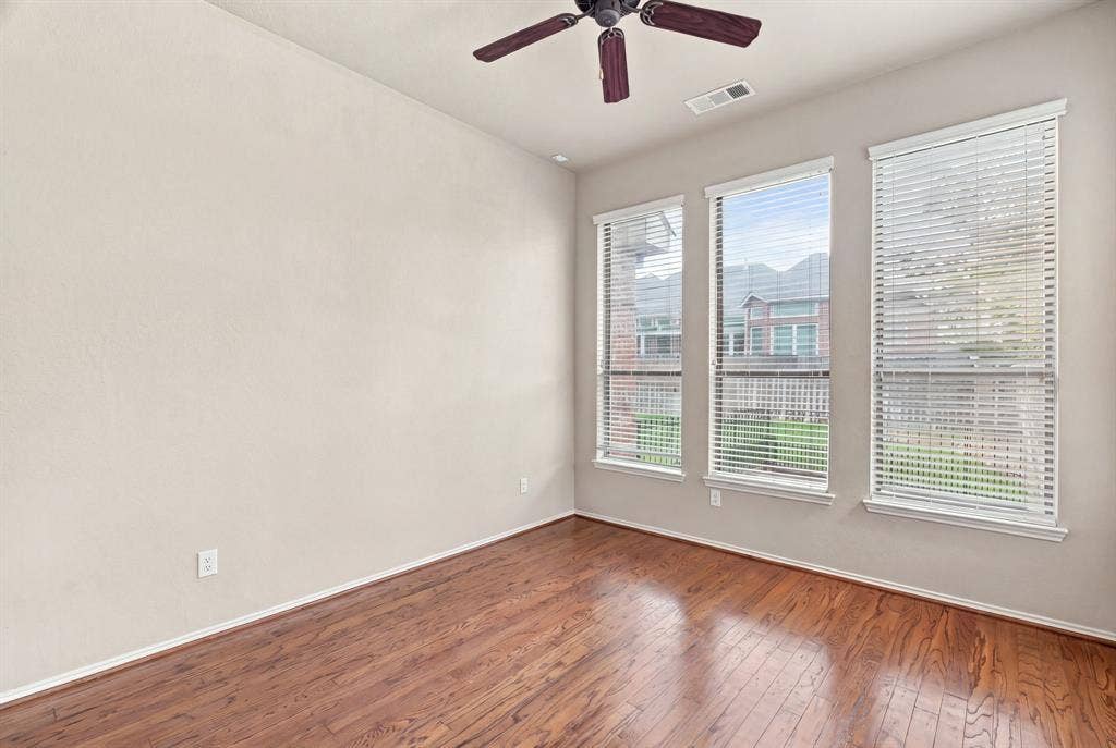 4220 Boxwood Drive, Denton, TX 76208 Study with hardwoods, two walls of windows! and a double sided fireplace