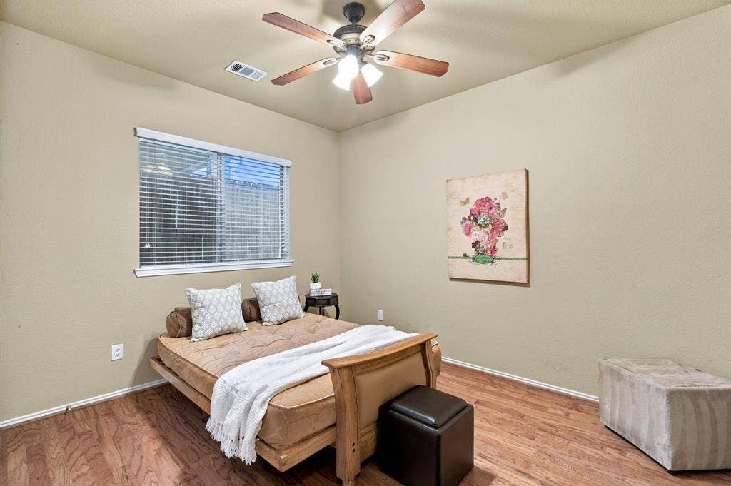 4220 Boxwood Drive, Denton, TX 76208 3rd Bedroom downstairs with hardwood flooring