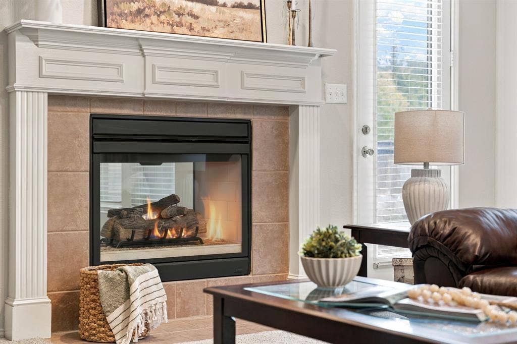 4220 Boxwood Drive, Denton, TX 76208 Double Sided glass front gas fireplace welcome you into the home. Flip it on with a Switch!