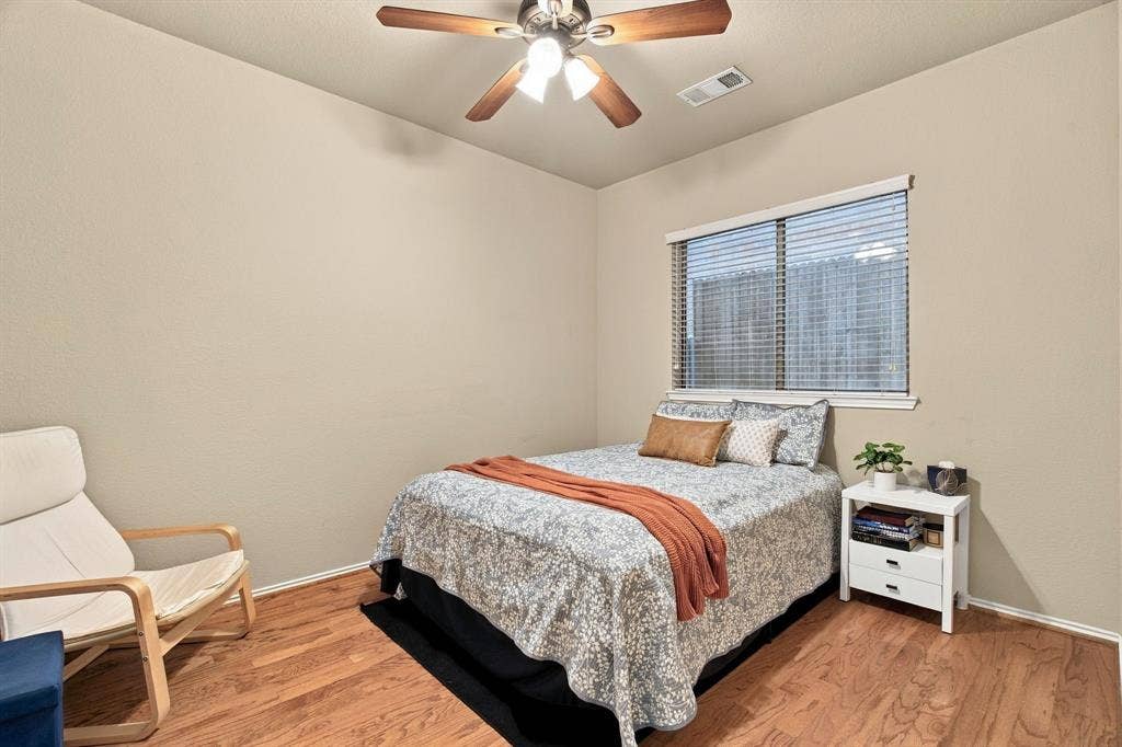 4220 Boxwood Drive, Denton, TX 76208 2nd Bedroom downstairs with hardwood flooring