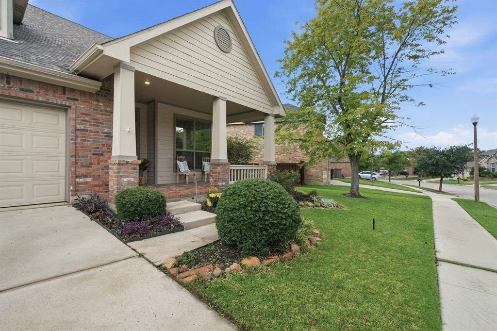 4220 Boxwood Drive, Denton, TX 76208 Sit on your front porch enjoying the day on this quiet street of Pecan Creek.