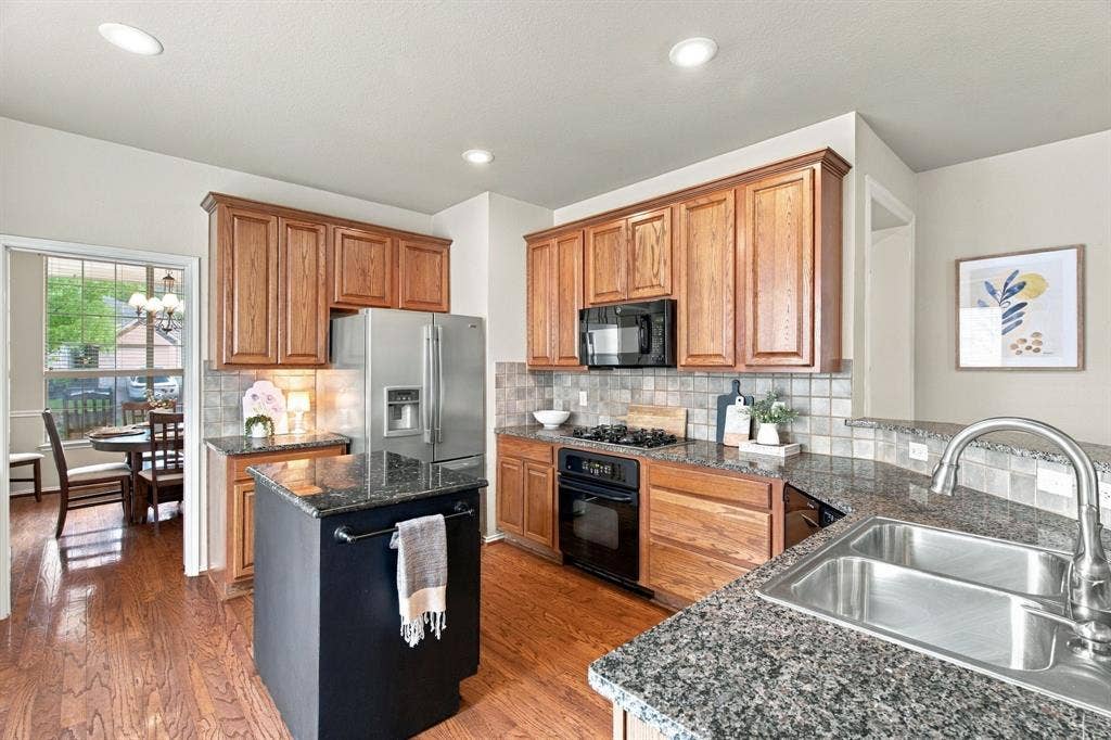 4220 Boxwood Drive, Denton, TX 76208 Removable island on wheels, you can expand the space if you wish by taking that out.