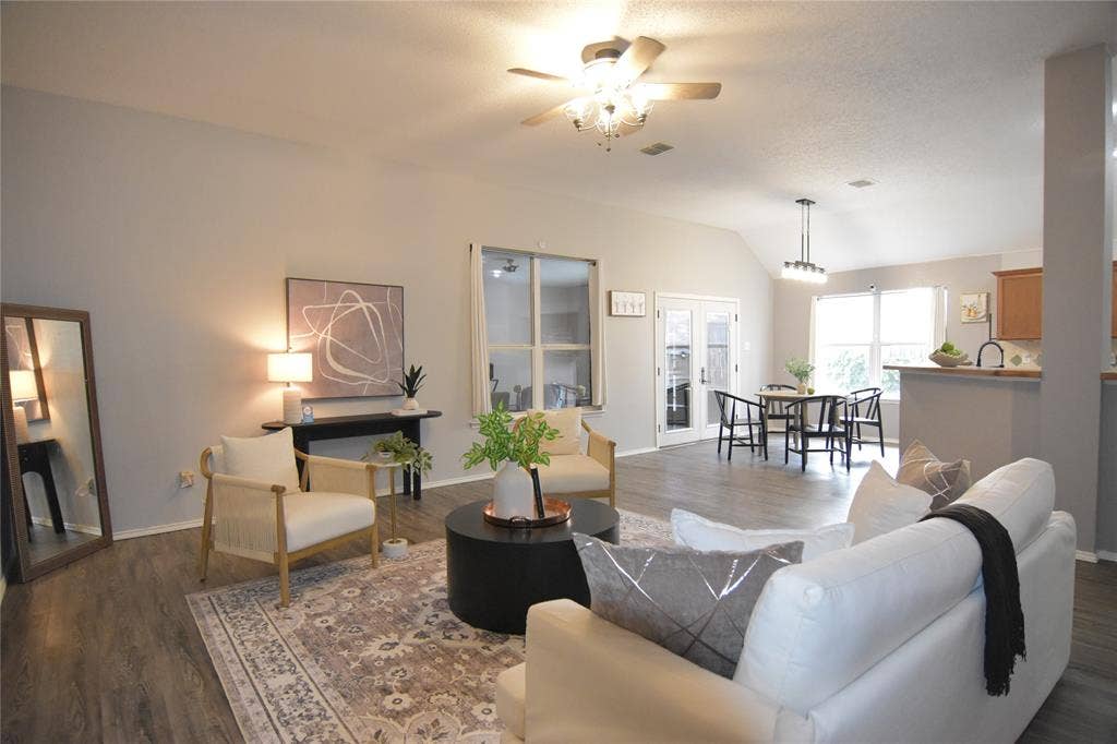 215 Longhorn Trail, Grand Prairie, TX 75052 Vaulted ceiling with a ceiling fan, wood-finish flooring, and white interior walls