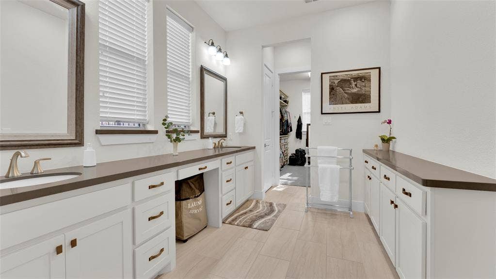 5925 Mayhew Court, McKinney, TX 75070 Cabinet added above toilet.