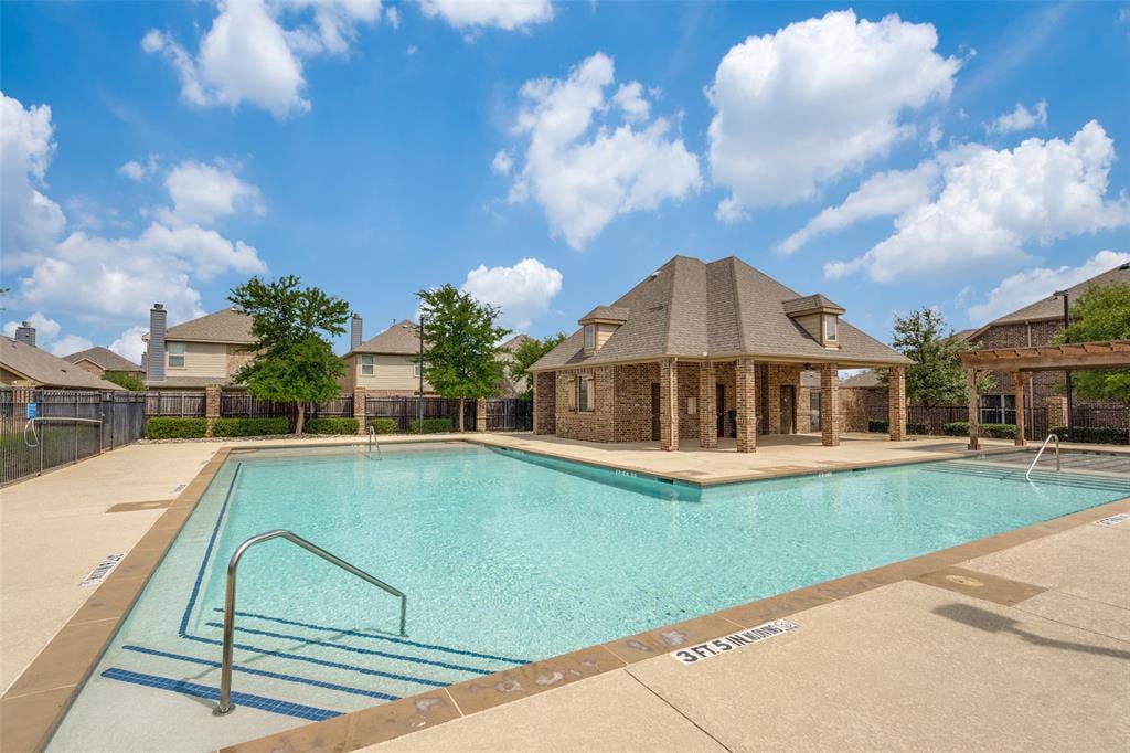 9801 Moccasin Creek Lane, McKinney, TX 75071 Community swimming pool with concrete decking, a brick and shingle pavilion, and metal handrails