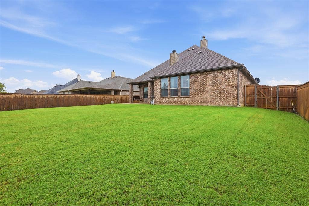 Large yard with newly installed fencing.