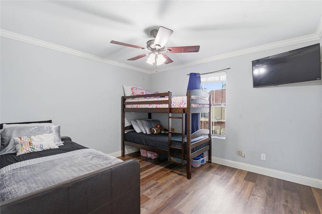 212 Samuel Boulevard, #3, Coppell, TX 75019 Wood-finish flooring, crown molding, and a ceiling fan with integrated lighting