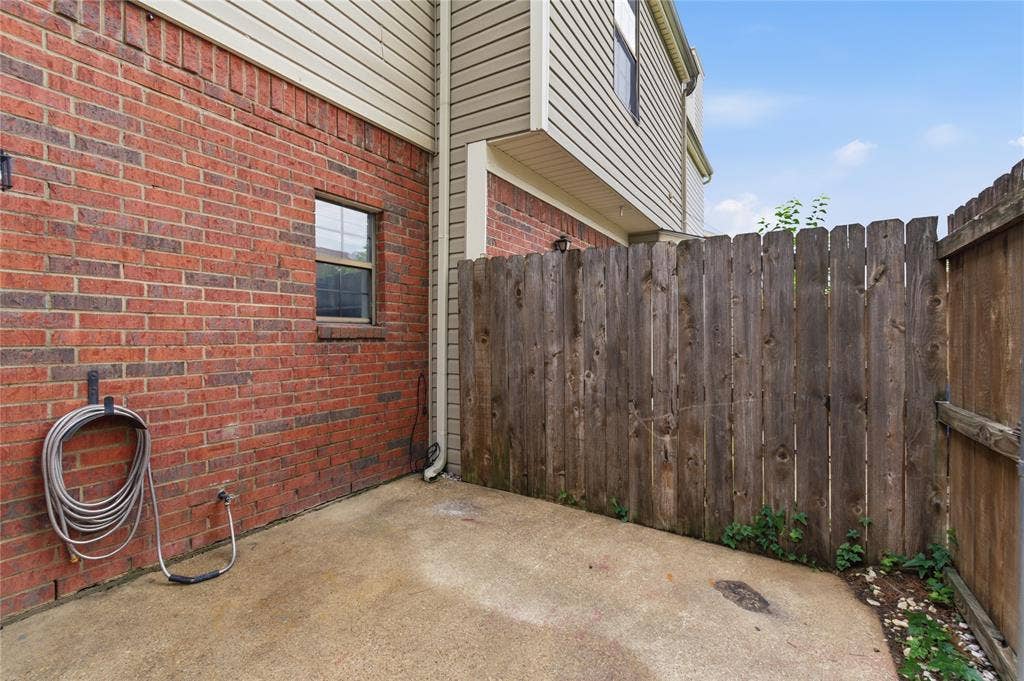 212 Samuel Boulevard, #3, Coppell, TX 75019 Brick exterior with siding, privacy fencing, and concrete patio