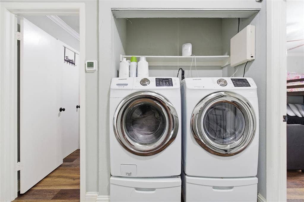 212 Samuel Boulevard, #3, Coppell, TX 75019 Dedicated laundry area featuring a built-in shelf and wood-finish flooring