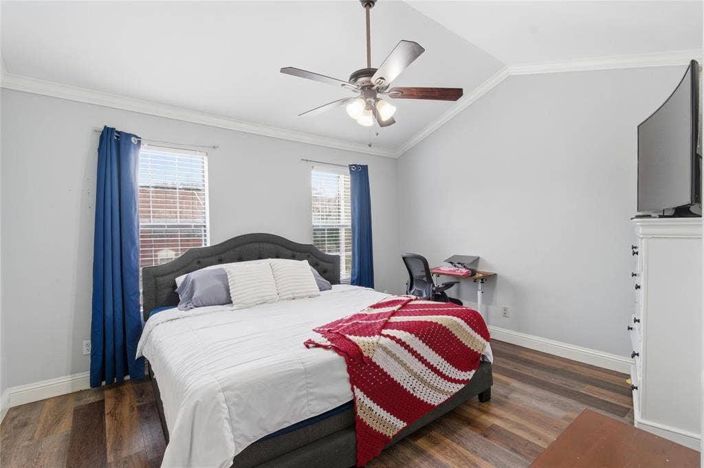 212 Samuel Boulevard, #3, Coppell, TX 75019 Vaulted ceiling, wood-finish flooring, ceiling fan with integrated lighting, two windows with blinds, crown molding