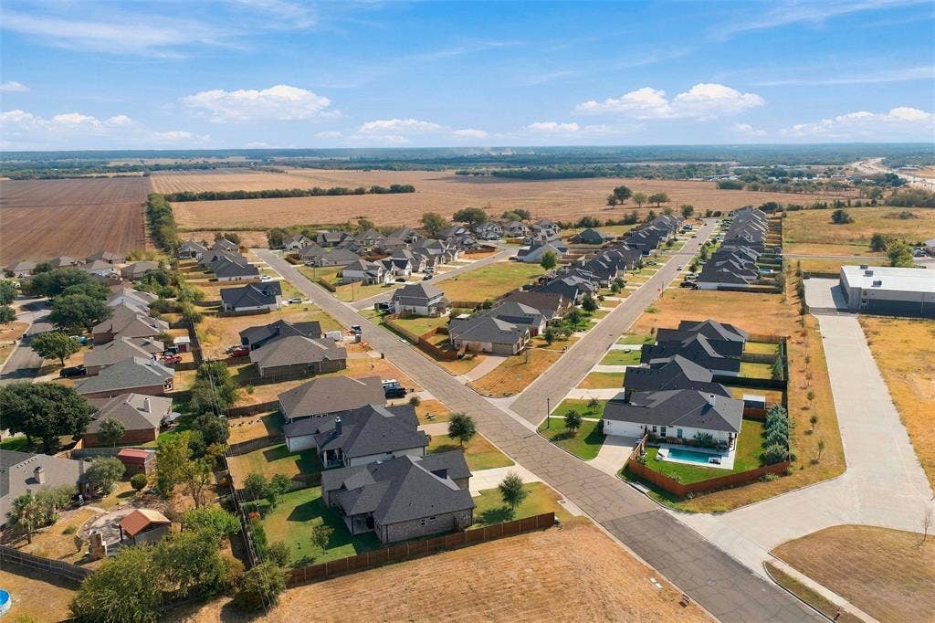 9932 Bridlewood Lane, Waco, TX 76708 Residential community featuring a variety of single-story homes with dark-pitched roofs