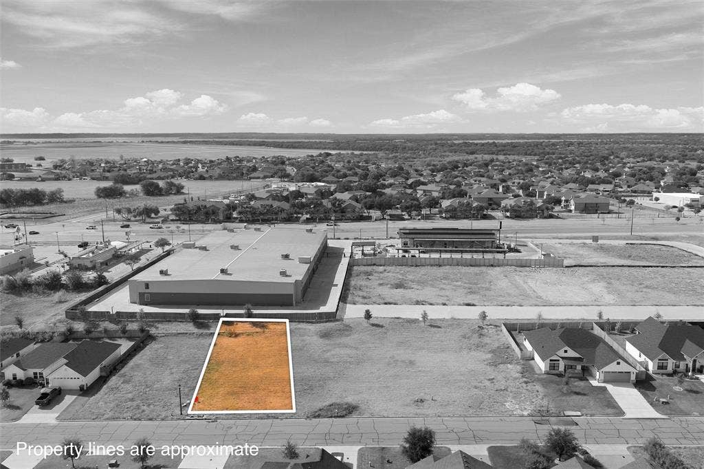 9932 Bridlewood Lane, Waco, TX 76708 Cleared building lot with surrounding commercial and residential structures