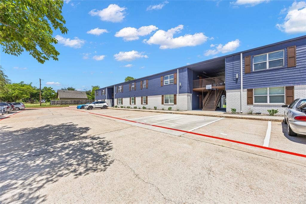 4639 Williams Road, #219, Benbrook, TX 76116 View of property featuring stairs and uncovered parking