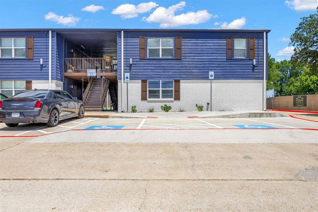 4639 Williams Road, #219, Benbrook, TX 76116 View of property with uncovered parking and stairs