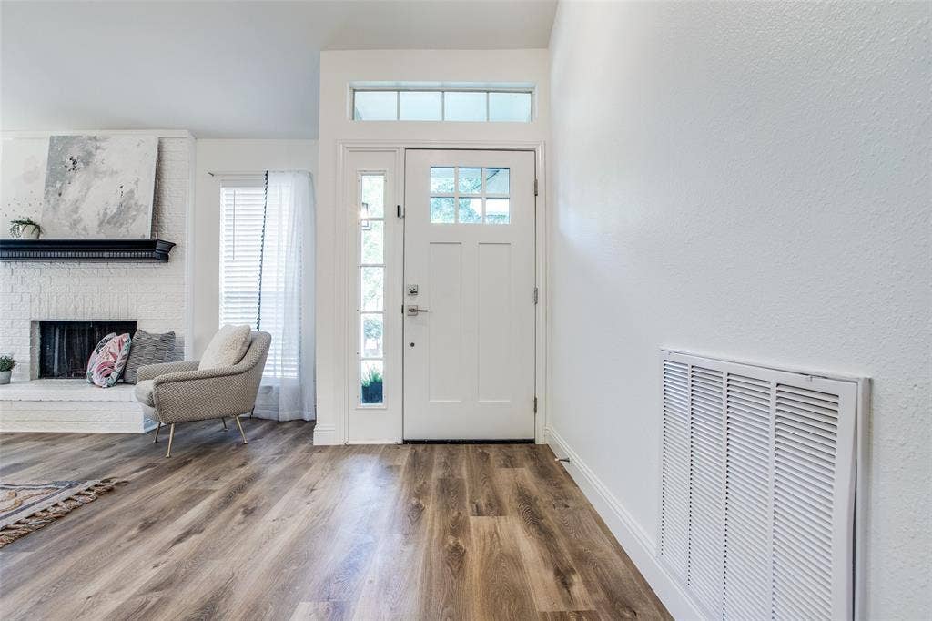8341 Edgewater Drive, Frisco, TX 75034 Entry door with divided lites, transom window, and a sidelite