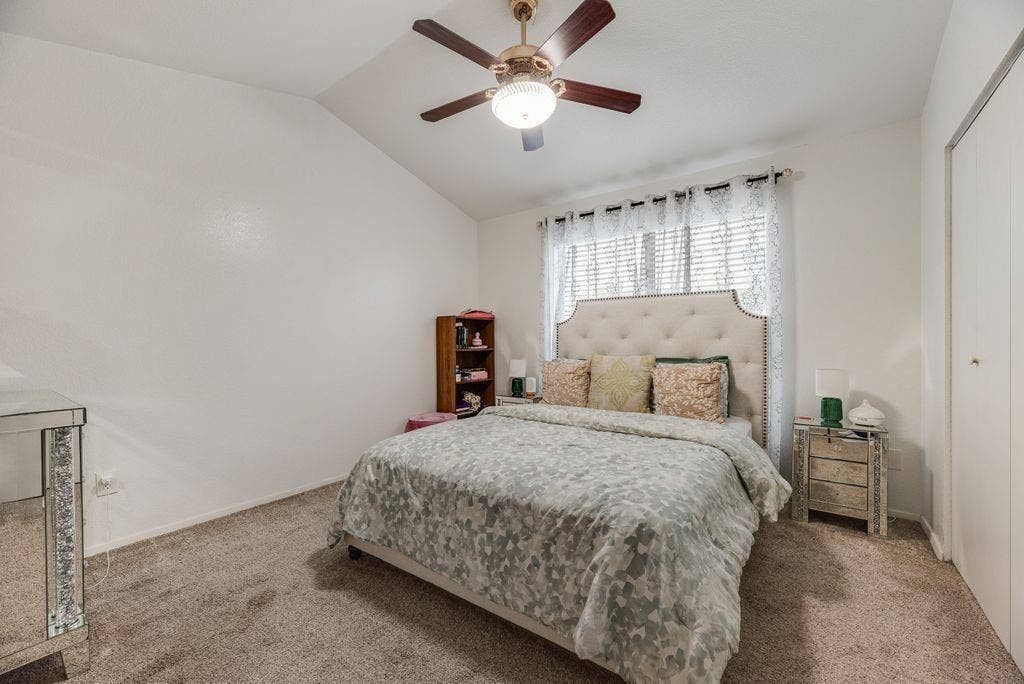3801 14th Street, #1905, Plano, TX 75074 Vaulted ceiling with a ceiling fan, carpet flooring, and a built-in closet with bifold doors