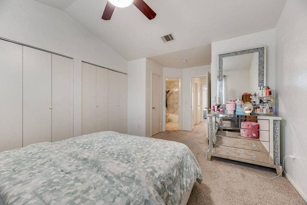 3801 14th Street, #1905, Plano, TX 75074 Vaulted ceiling, ceiling fan, neutral carpet flooring, white walls, and built-in closet storage