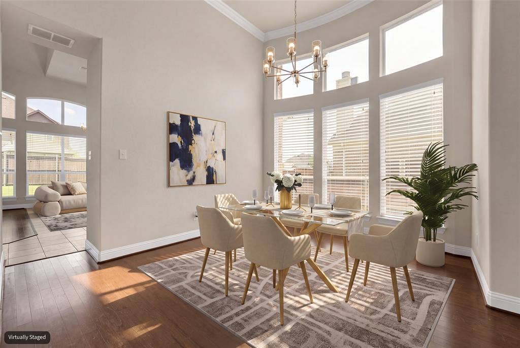 6811 Shady View Court, Sachse, TX 75048 High ceilings and abundant natural light illuminate the wood-finish flooring