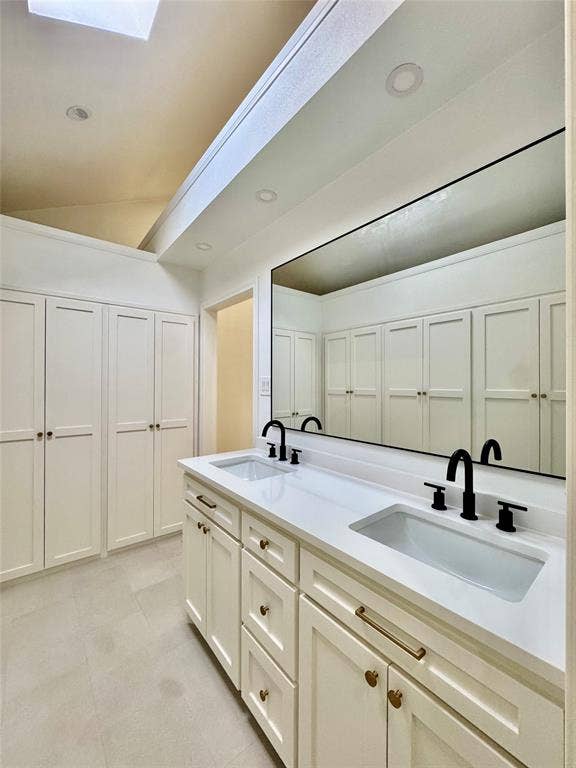 3706 Aries Drive, Garland, TX 75044 Dual vanity with integrated sinks, white countertops, and matte black fixtures