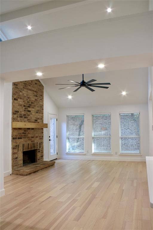 3706 Aries Drive, Garland, TX 75044 Vaulted ceiling with recessed lighting, brick fireplace with wood mantel, light wood-finish flooring, and multiple windows