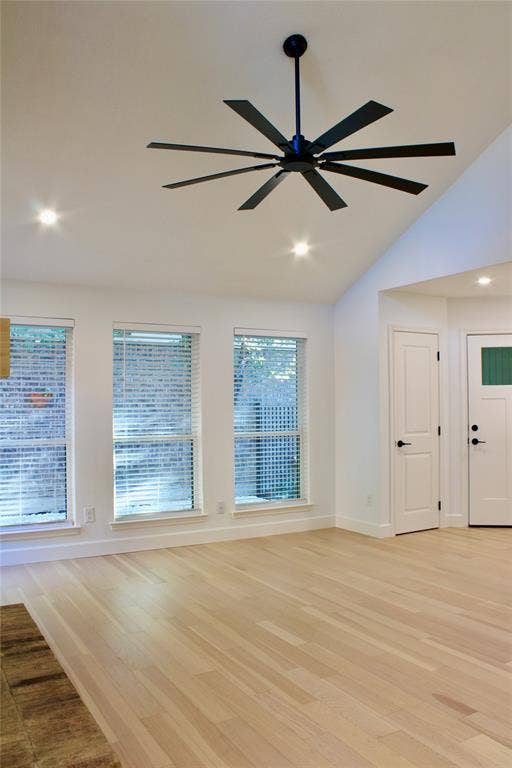 3706 Aries Drive, Garland, TX 75044 Vaulted ceiling featuring a multi-blade ceiling fan, recessed lighting, and wood-finish flooring