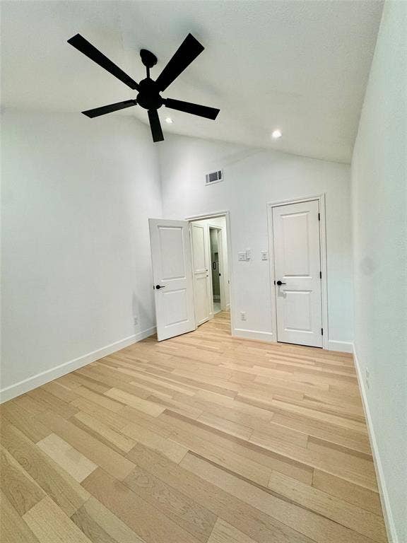 3706 Aries Drive, Garland, TX 75044 Vaulted ceiling with a black ceiling fan, recessed lighting, wood-finish flooring, and white paneled doors